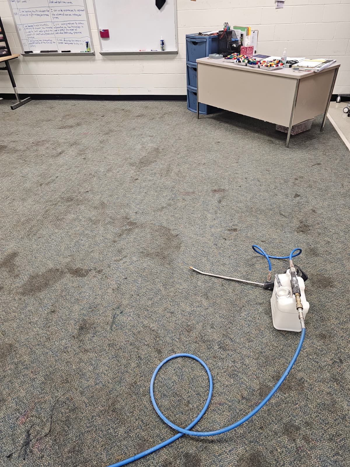 Wide classroom carpet stain removal before cleaning
